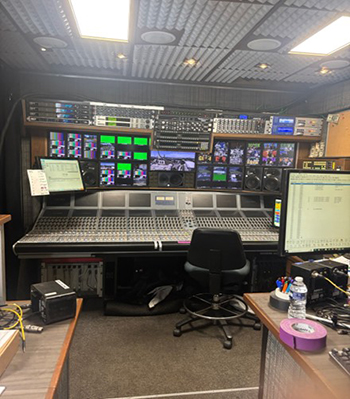 Behind-the-scenes view of monitors and and control board in the production facilities.
